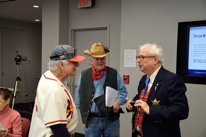 Two of those dastardly Walker Brothers (Lawrence and Pat) confer with the announcer (Edgar)