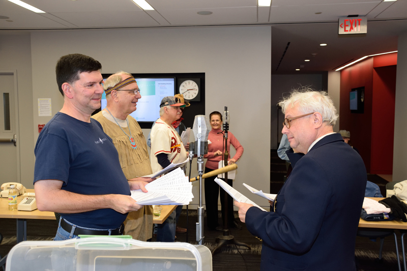 Denis (unmasked Lone Ranger) and Edgar confer before the rehearsal