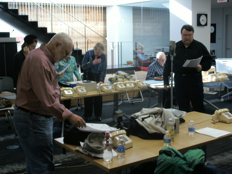 Michael Hayde reads while John Abbott follows along