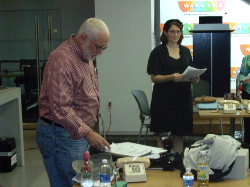 Sally reads as John Abbott studies the script