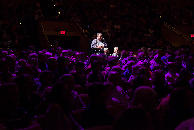 An audience member asks a question